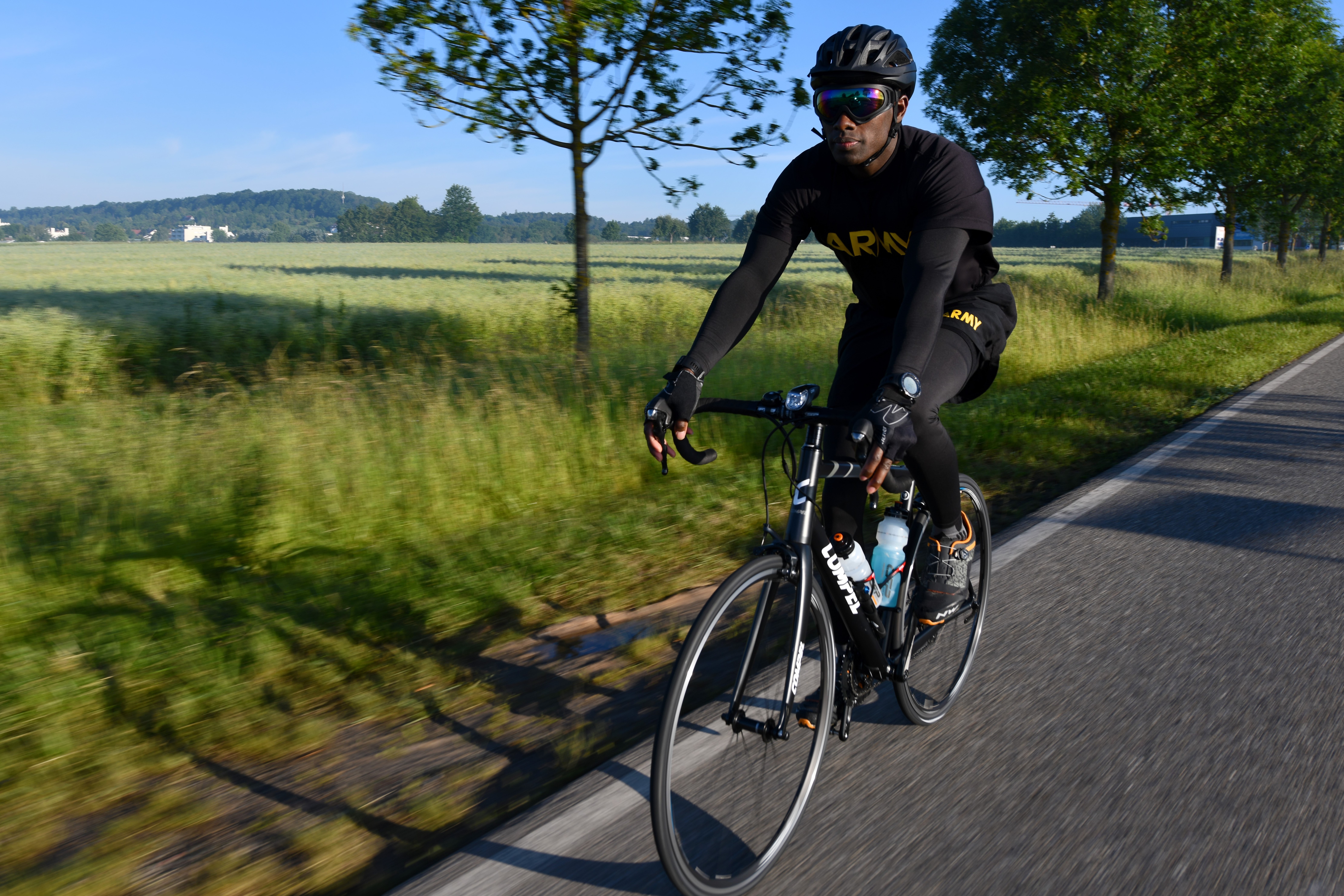 A man rides his bicycle on the road