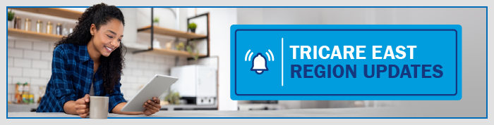 Woman typing with "TRICARE East Region Updates" banner