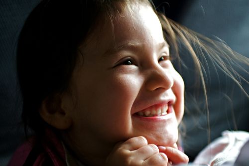 Young child smiling at the camera