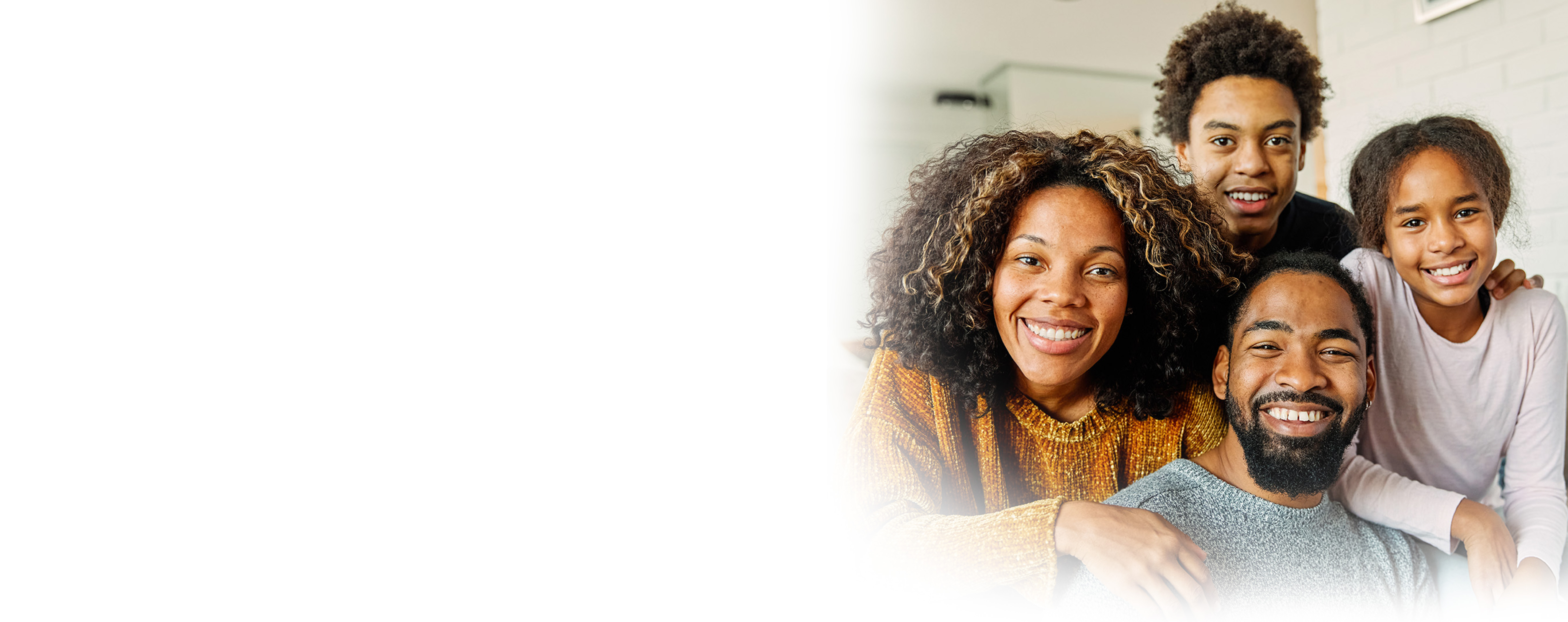 African-American family posing and smiling
